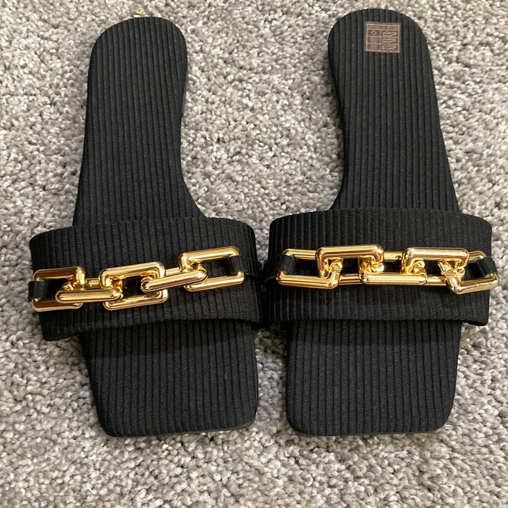 Women sandals black and gold never used